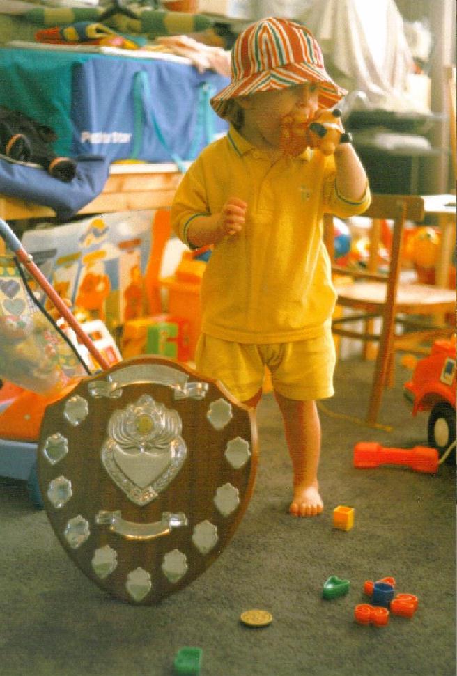 Jessica stands by her first trophy. Mum and Dad had won the London Scrabble League Handicapped Pairs Shield event in 1996.